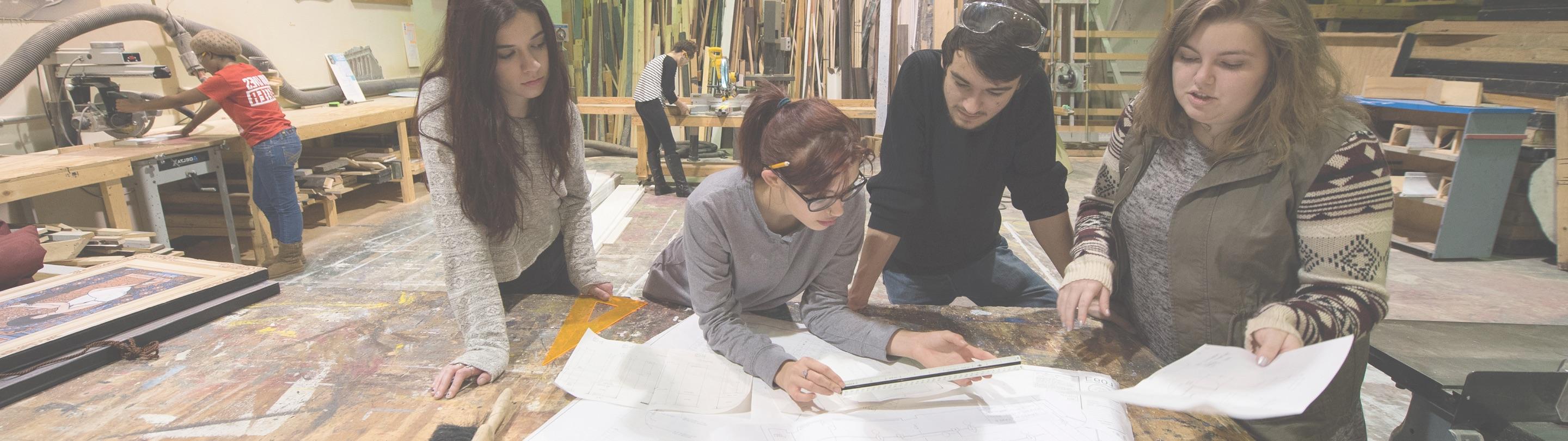 Students working on projects on table